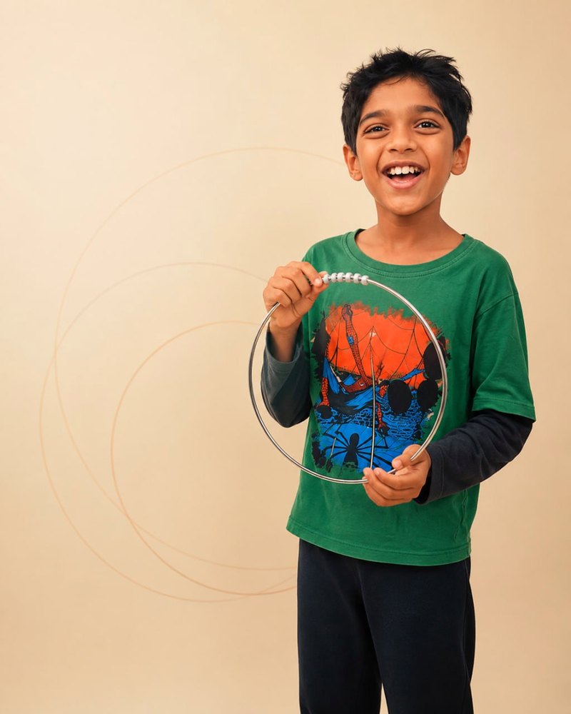 A boy laughing while playing the Ghur.Andar ring